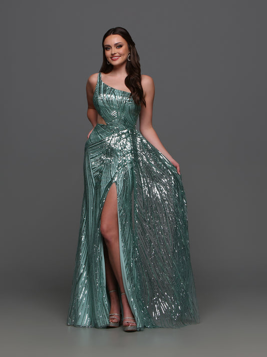 Elevate your formal look with the Candice Wang 72323 Sequin One Shoulder Cutout Dress. The sequin detailing adds a touch of glamour while the one shoulder and cutout design creates a sophisticated silhouette. The overskirt and maxi slit add a modern twist to this classic gown.  Sizes: 0-16  Colors: Sage