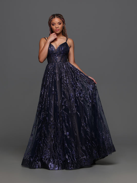 Expertly crafted for elegance and sophistication, the Candice Wang 72329 Size 20 Navy Sheer A Line Prom Dress is a stunning choice for any formal occasion. With its A-line silhouette and V-neck design, this dress flatters your curves while providing a touch of glamour. The sheer details add a hint of allure, making you the center of attention.