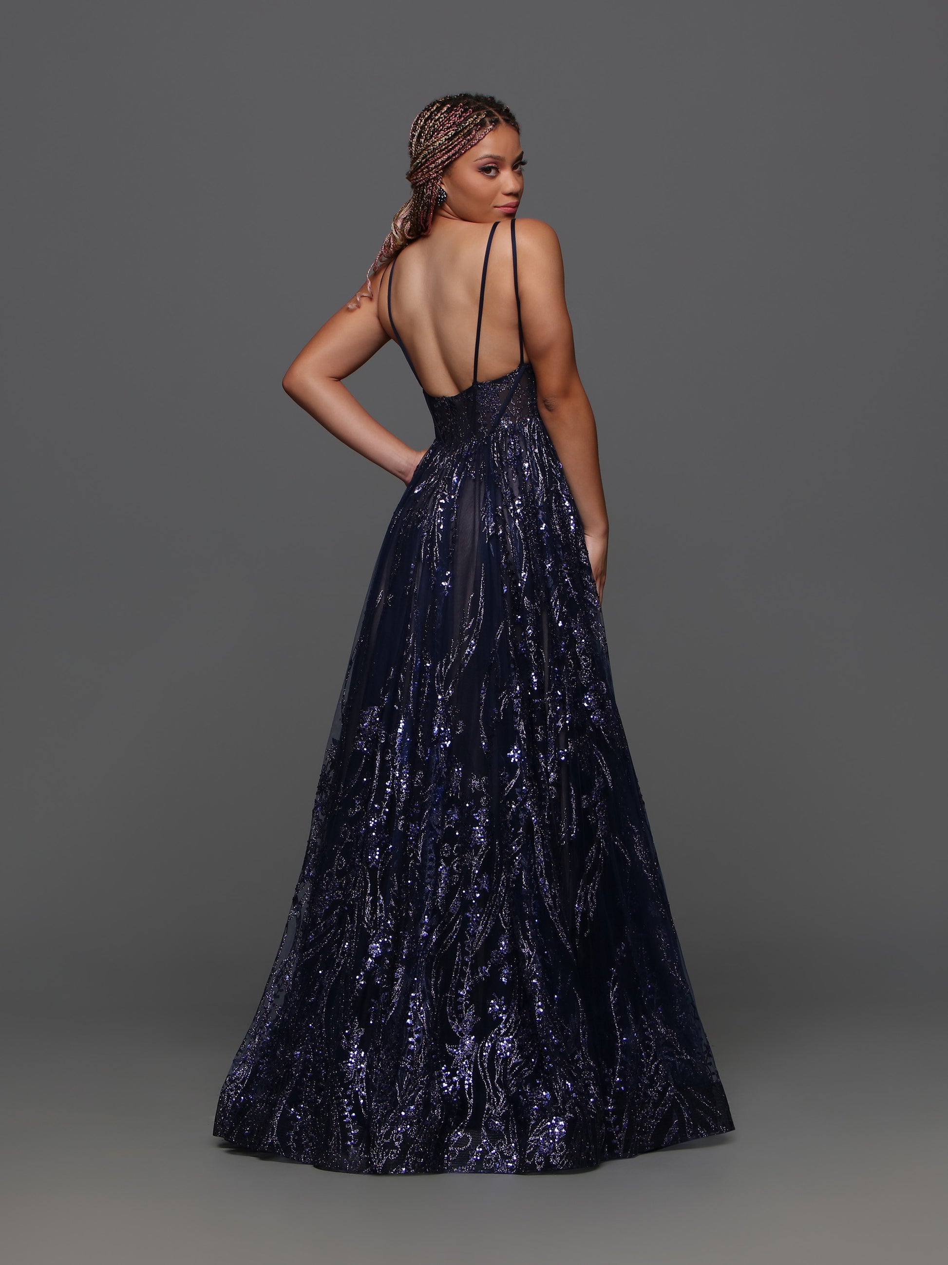 Expertly crafted for elegance and sophistication, the Candice Wang 72329 Size 20 Navy Sheer A Line Prom Dress is a stunning choice for any formal occasion. With its A-line silhouette and V-neck design, this dress flatters your curves while providing a touch of glamour. The sheer details add a hint of allure, making you the center of attention.