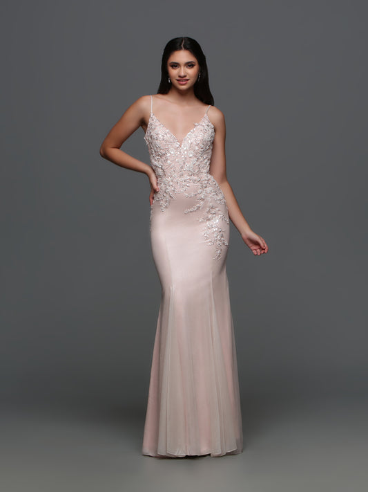 This Candice Wang evening gown style 72331 exudes elegance and sophistication. With its fitted silhouette and metallic shimmer, it will make you stand out at any formal event. The lace, beaded sequin details and cutout back add a touch of glamour. Perfect for prom or any special occasion.  Sizes: 0-10  Colors: Ice Pink, Lavender