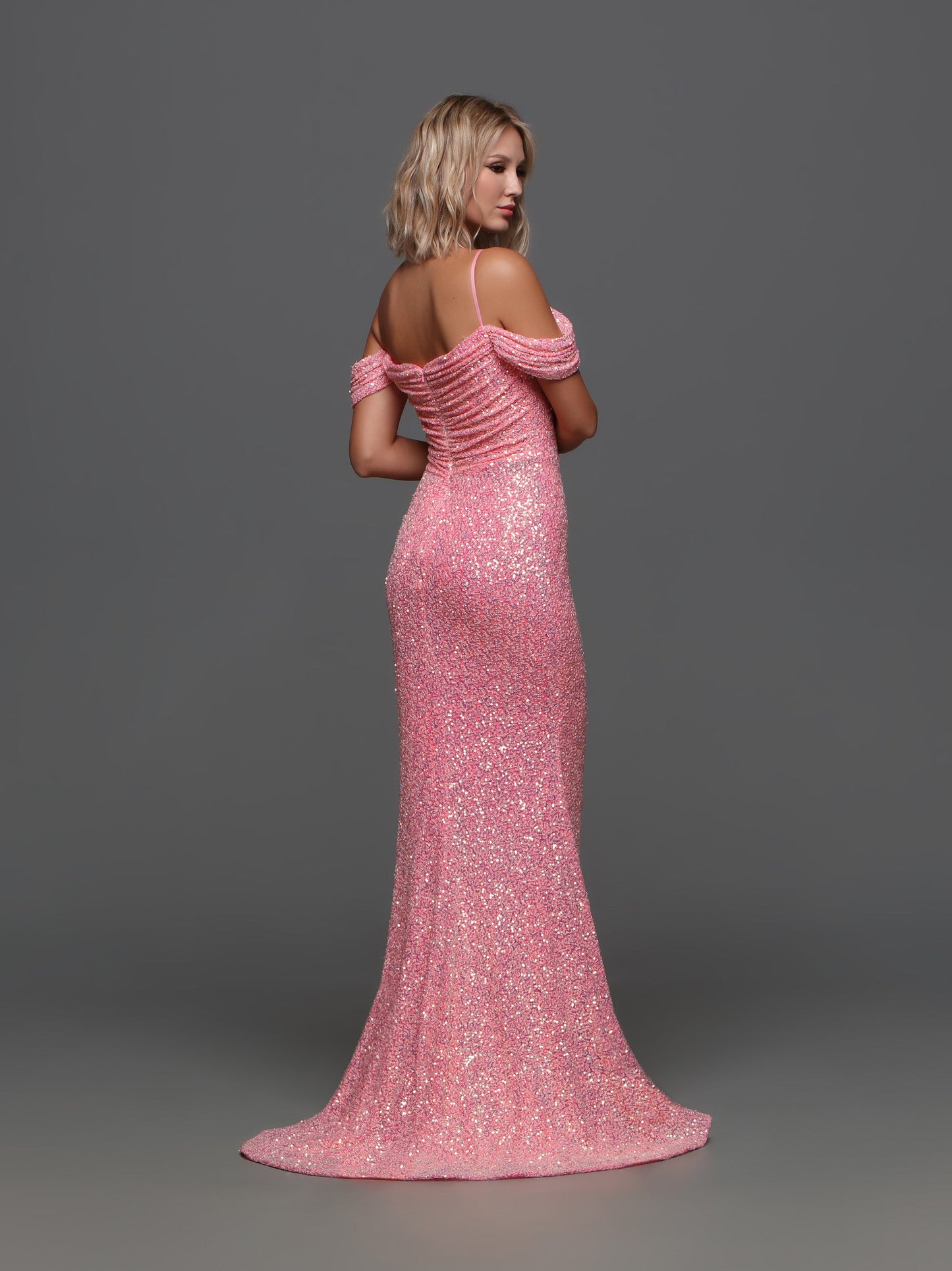 The Candice Wang 72335 Prom Dress is the perfect blend of glamour and sophistication. The sequin corset adds a touch of sparkle, while the high slit and off the shoulder design exude elegance. The scoop neck and ruched details create a flattering silhouette. Elevate your prom night with this stunning dress.  Sizes: 0-20  Colors: Neon Pink