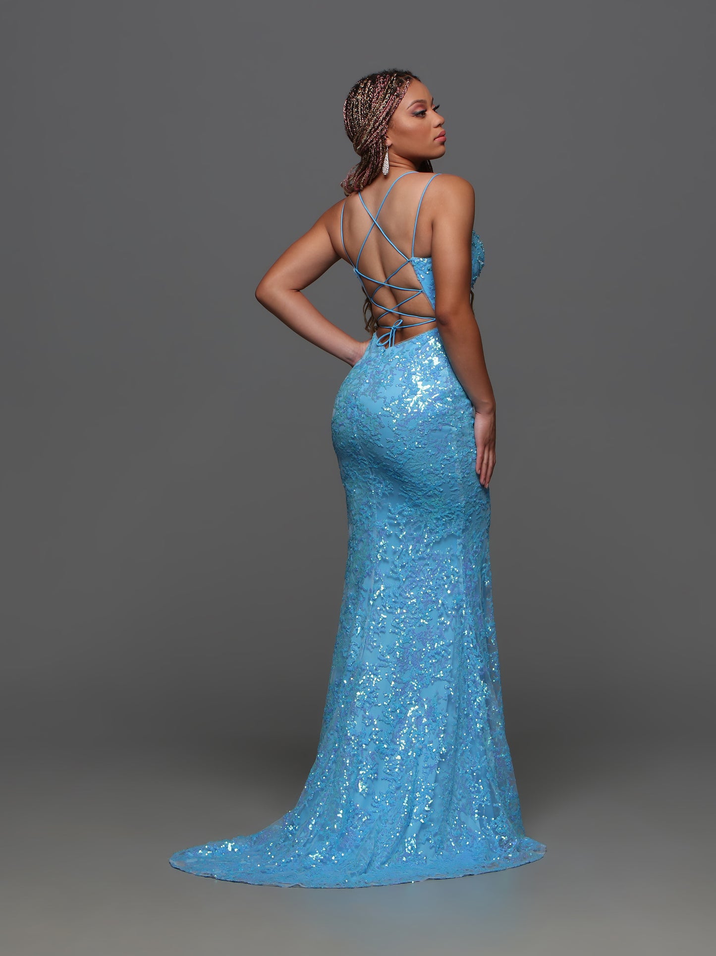 Elevate your prom night look with the stunning Candice Wang 72369 Sequin High Slit Backless Prom Dress. This elegant dress features a beautiful cowl neck, intricate beadwork, and a high slit for added glamour. With its sleek backless design, this formal gown is sure to turn heads.  Sizes: 0-20  Colors: Blue