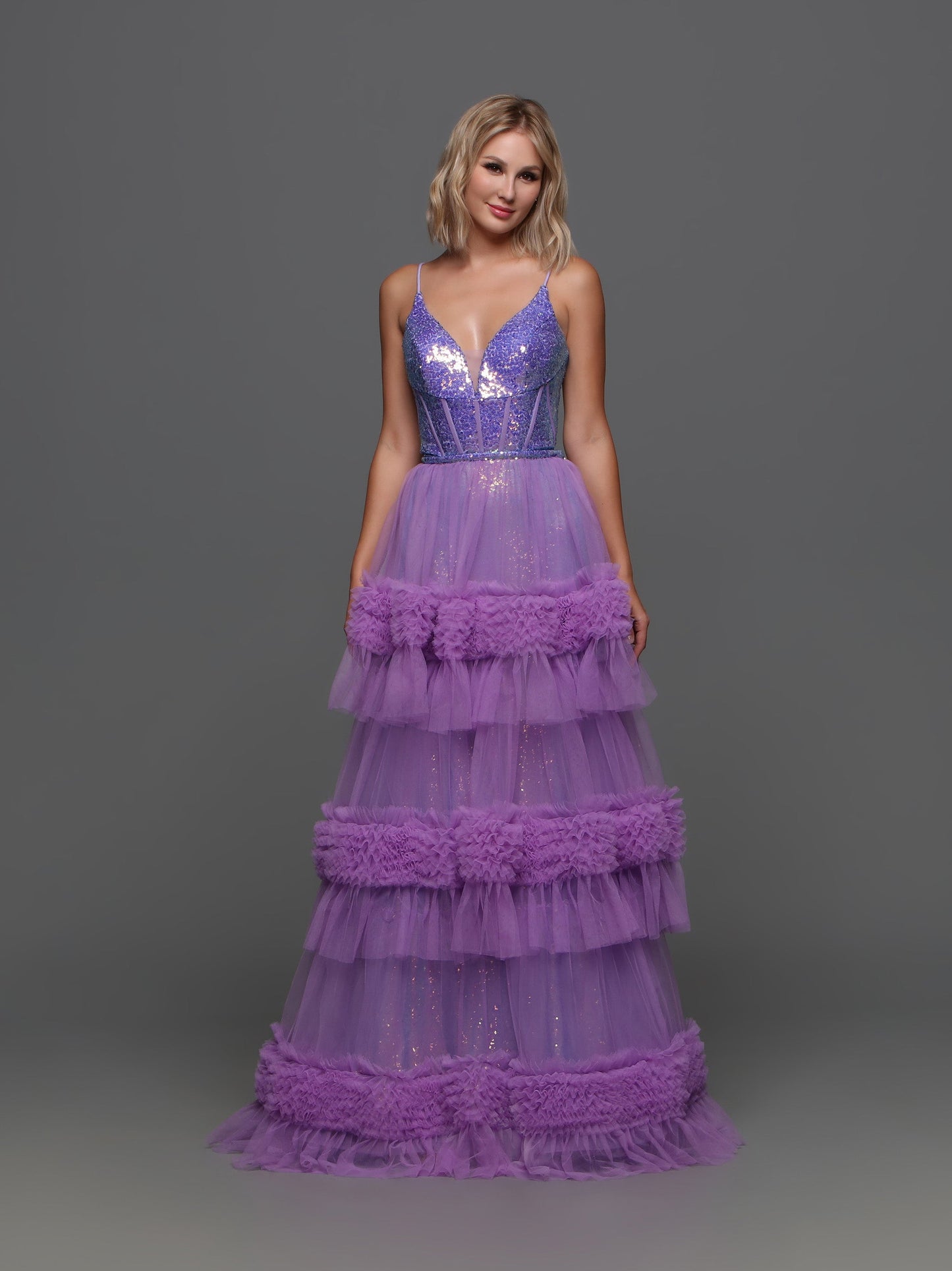 The Candice Wang 72377 Sequin V Neck Prom Dress features a fitted sequin silhouette with a stunning sequin V-neck corset bodice. The Detachable pleated tulle skirt adds layers for a full and luxurious look. Perfect for prom or any special occasion.  Sizes: 0-20  Colors: Purple, Pink