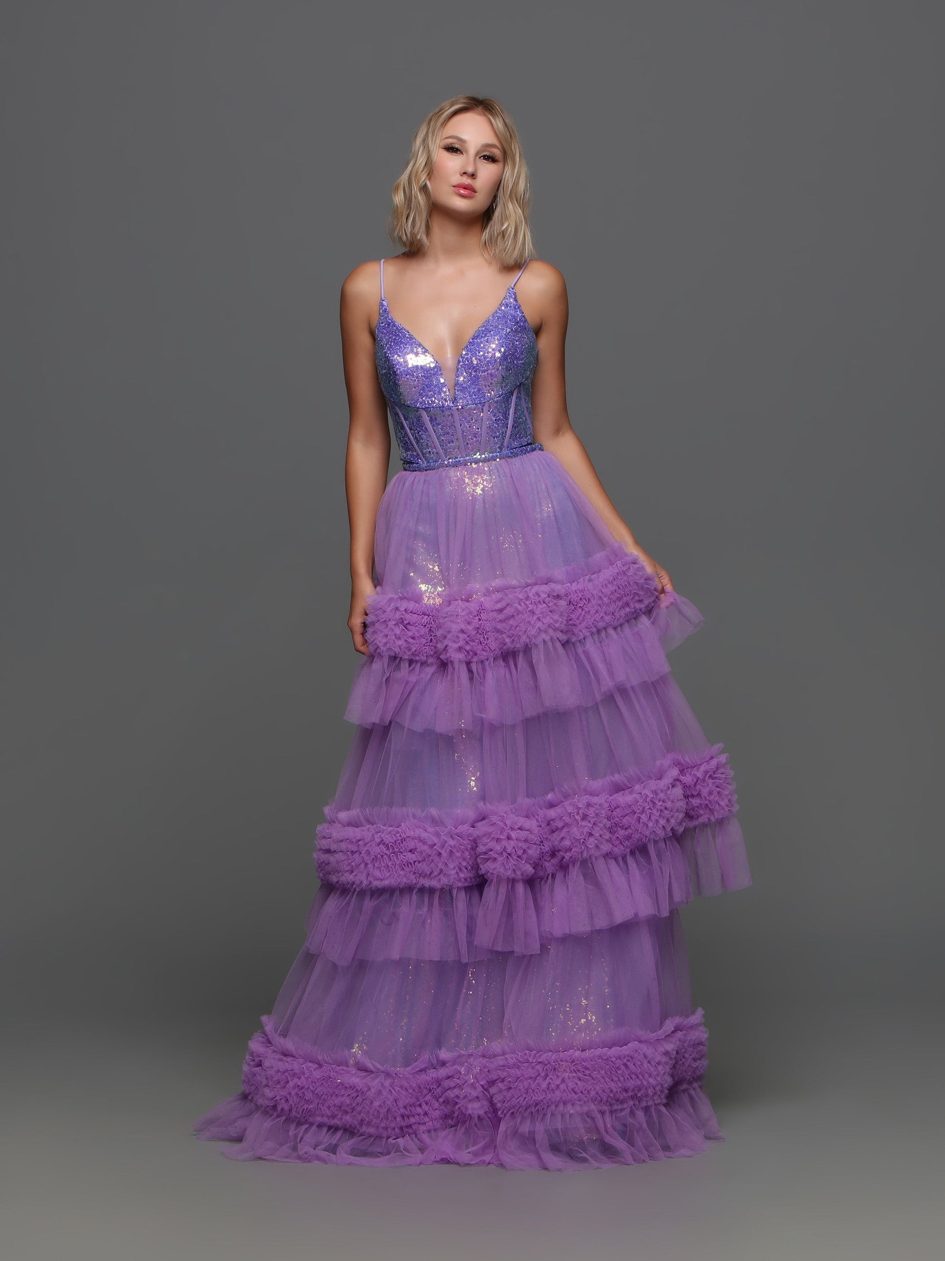 The Candice Wang 72377 Sequin V Neck Prom Dress features a fitted sequin silhouette with a stunning sequin V-neck corset bodice. The Detachable pleated tulle skirt adds layers for a full and luxurious look. Perfect for prom or any special occasion.  Sizes: 0-20  Colors: Purple, Pink