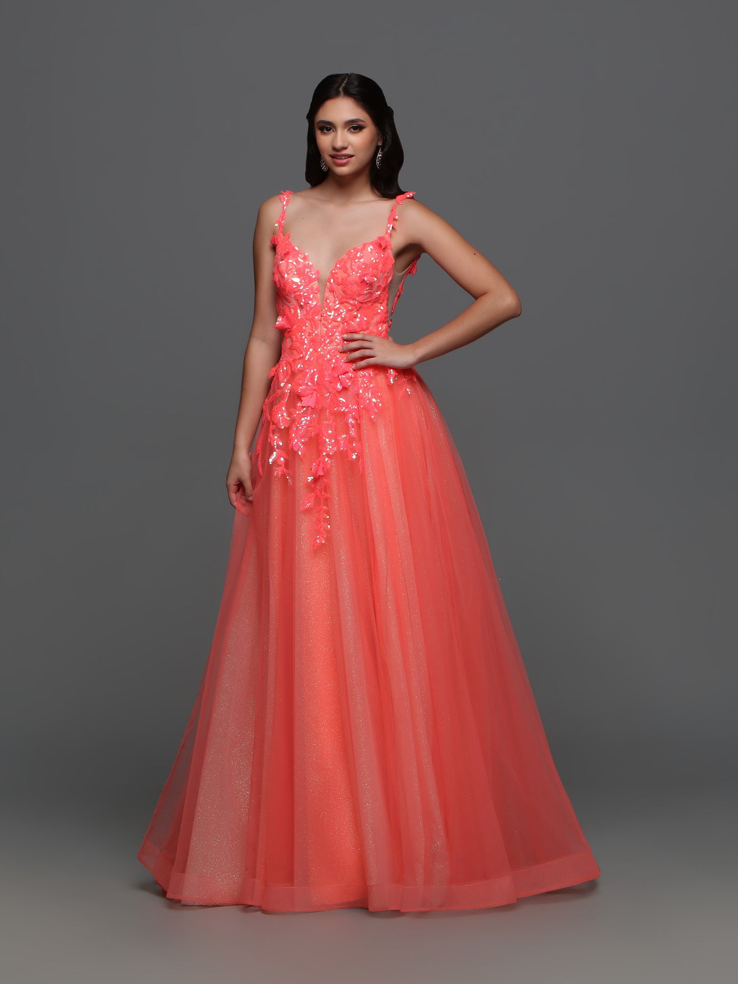 Elevate your formal look with the Candice Wang 72388 Long Shimmer Sequin Ballgown Prom Dress. The A-line silhouette and Glitter tulle details are complemented by the shimmering sequin lace, giving you an undeniable sparkle. Make a statement at your next event with this elegant and stylish dress.  Sizes: 0-20  Colors: Coral 