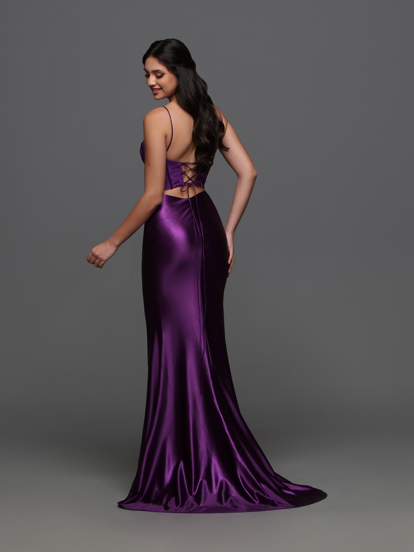 The Candice Wang 72392 Lace Corset Satin Dress is the perfect choice for your formal event. The fitted silhouette and corset lace detailing accentuate your figure, while the cut out back and slit add a touch of elegance. Made with high quality satin, this dress is both comfortable and luxurious.  Sizes: 0-16  Colors: Purple, Royal