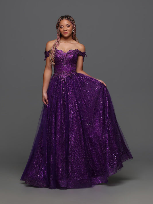 The Candice Wang 72405 A Line Glitter Tulle Lace Prom Dress features an off the shoulder design and a corset for a stunningly elegant look. The A-line shape, glitter tulle, and intricate lace details add a touch of glamour to this formal gown. Perfect for any special occasion.  Sizes: 0-20  Colors: Purple
