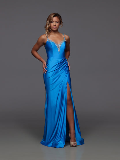Turn heads in the Candice Wang 72442 prom dress, crafted to hug your silhouette in a striking peacock hue. This long, fitted gown features a dazzling crystal-embellished V-neck and a flattering corset design that sculpts your figure. The ruched fabric adds texture while the high slit offers a bold, confident edge—perfect for making a memorable entrance at your next event.

Size: 10

Colors: Peacock