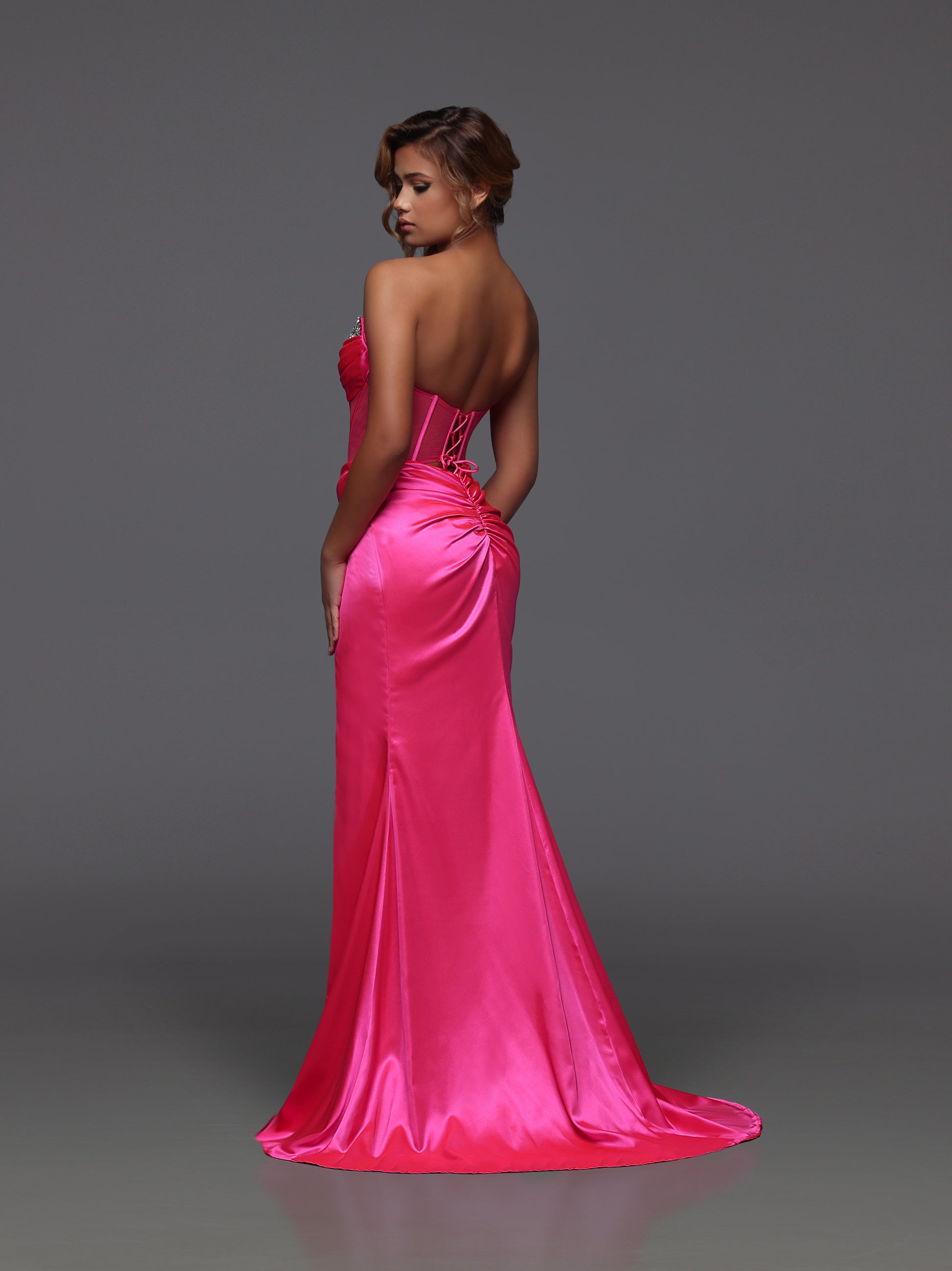 Step into the spotlight with this neon pink sheer corset prom dress by Candice Wang. Featuring a crystal-studded V neckline and a ruched back, this size 6 design is crafted to highlight your bold style. The sheer fabric and structured corset create a daring silhouette that demands attention at any event.

Size: 6

Color: Neon Pink