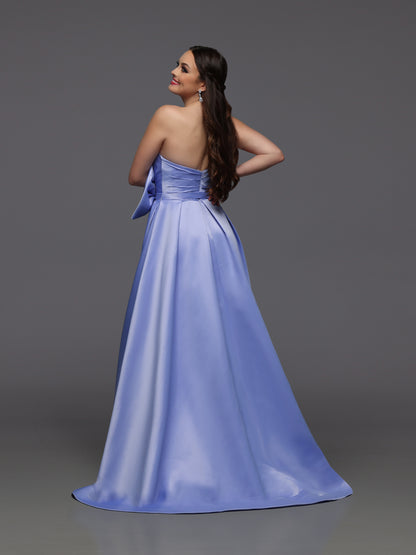 Discover elegance and glamour with the Candice Wang 72499 Royal Satin Maxi Slit A Line Bow Prom Dress. This stunning formal dress features a crystal-embellished V-neck and a gorgeous bow detail. With its A-line silhouette and thigh-high slit, it's perfect for any pageant or prom.&nbsp;

Sizes: 8

Colors: Royal