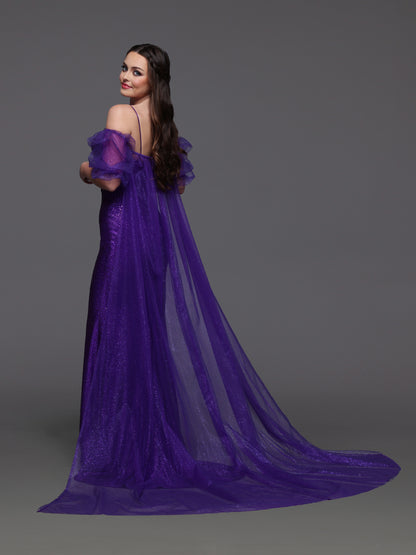 Elevate your prom look with the Candice Wang 72521 dress. This glittery fitted dress features a detachable puff sleeve cape for added drama. Stand out in style and comfort with the perfect fit and eye-catching design. Step out confidently and make a statement at your special event.

Size: 8

Color: Purple