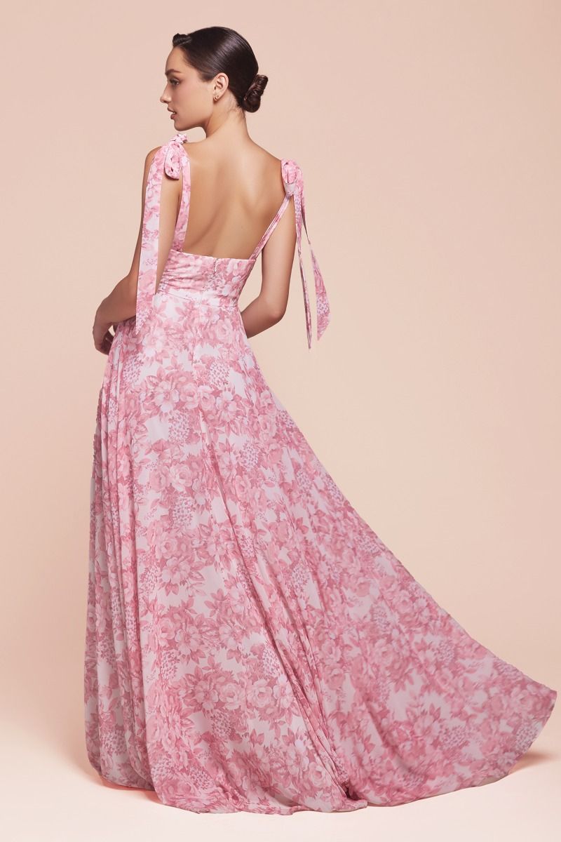 stunning backless dresses A stunning backless dress designed with a clean square neckline that frames the collarbone beautifully. Featuring unique, eye-catching prints, this piece blends elegance modern touch. Finished with