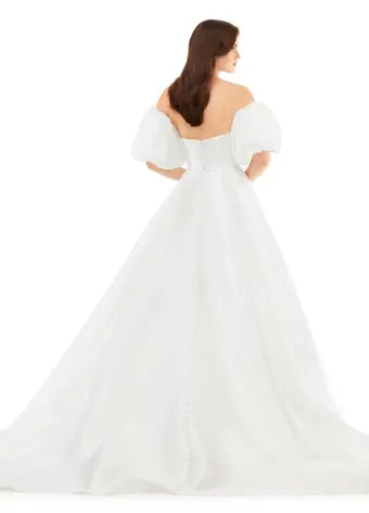 Ashley Lauren 11323 Strapless Detachable Puff Sleeves Phantom Satin Ballgown Dress. This stunning sweetheart ball gown comes with detachable balloon sleeves that give the perfect flare. The back of the gown is adorned with buttons.
