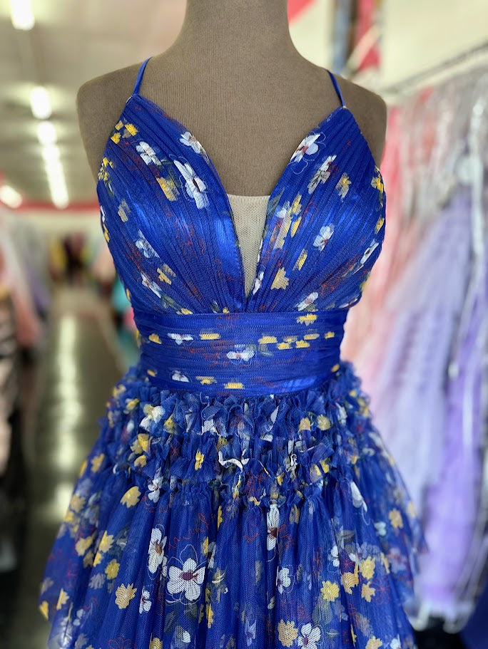 Elevate your formal occasion with the Nina Canacci 7601, a size 2 royal print gown that blends elegance and modern design. Featuring a flattering pleated A-line silhouette, a structured corset bodice, and a tasteful slit, this dress offers both sophistication and comfort. Perfect for prom or any special event, it ensures you stand out with timeless style and graceful movement.

Size: 2

Color: Royal/Print