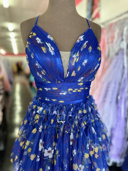 Elevate your formal occasion with the Nina Canacci 7601, a size 2 royal print gown that blends elegance and modern design. Featuring a flattering pleated A-line silhouette, a structured corset bodice, and a tasteful slit, this dress offers both sophistication and comfort. Perfect for prom or any special event, it ensures you stand out with timeless style and graceful movement.

Size: 2

Color: Royal/Print