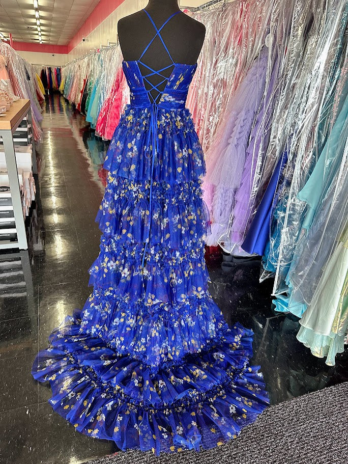 Elevate your formal occasion with the Nina Canacci 7601, a size 2 royal print gown that blends elegance and modern design. Featuring a flattering pleated A-line silhouette, a structured corset bodice, and a tasteful slit, this dress offers both sophistication and comfort. Perfect for prom or any special event, it ensures you stand out with timeless style and graceful movement.

Size: 2

Color: Royal/Print