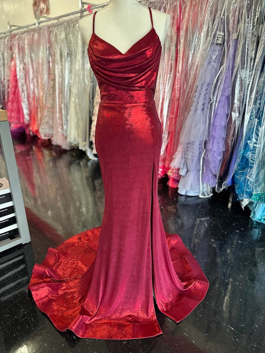 The Nina Canacci 7604 prom dress in size 2 features a striking burgundy metallic fabric that catches the light beautifully. This fitted gown highlights your silhouette with a structured corset bodice and a sophisticated cowl neck. A daring slit and elegant train add movement and drama, making it an ideal choice for formal events where you want to make a confident, refined statement.

Size: 2

Color: Burgundy