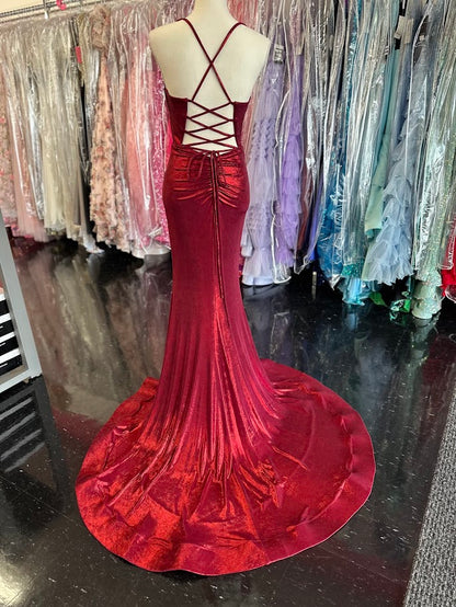 The Nina Canacci 7604 prom dress in size 2 features a striking burgundy metallic fabric that catches the light beautifully. This fitted gown highlights your silhouette with a structured corset bodice and a sophisticated cowl neck. A daring slit and elegant train add movement and drama, making it an ideal choice for formal events where you want to make a confident, refined statement.

Size: 2

Color: Burgundy