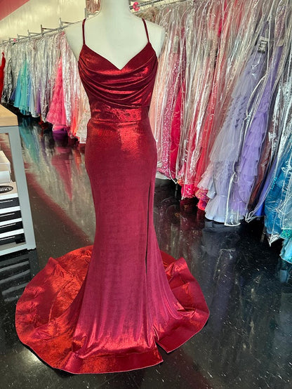 The Nina Canacci 7604 prom dress in size 2 features a striking burgundy metallic fabric that catches the light beautifully. This fitted gown highlights your silhouette with a structured corset bodice and a sophisticated cowl neck. A daring slit and elegant train add movement and drama, making it an ideal choice for formal events where you want to make a confident, refined statement.

Size: 2

Color: Burgundy