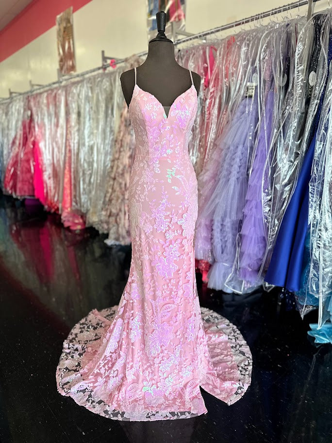 Elevate your evening with the Nina Canacci 7611, a size 4 fitted prom dress in delicate pink. This gown features intricate sequin lace, beaded fringe accents, and a sheer lace slit that adds a touch of allure. Designed to flatter your silhouette, it combines elegance and modern sophistication for unforgettable formal occasions.

Size: 4

Color: Light Pink