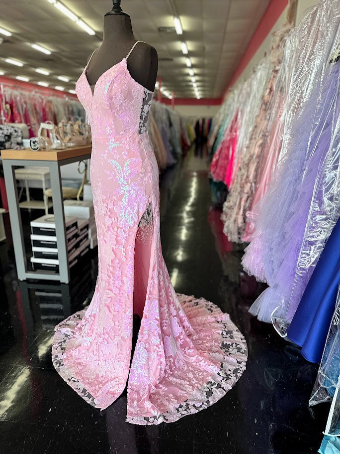 Elevate your evening with the Nina Canacci 7611, a size 4 fitted prom dress in delicate pink. This gown features intricate sequin lace, beaded fringe accents, and a sheer lace slit that adds a touch of allure. Designed to flatter your silhouette, it combines elegance and modern sophistication for unforgettable formal occasions.

Size: 4

Color: Light Pink