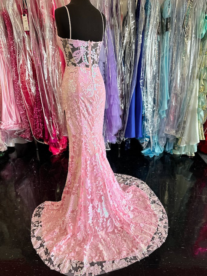 Elevate your evening with the Nina Canacci 7611, a size 4 fitted prom dress in delicate pink. This gown features intricate sequin lace, beaded fringe accents, and a sheer lace slit that adds a touch of allure. Designed to flatter your silhouette, it combines elegance and modern sophistication for unforgettable formal occasions.

Size: 4

Color: Light Pink