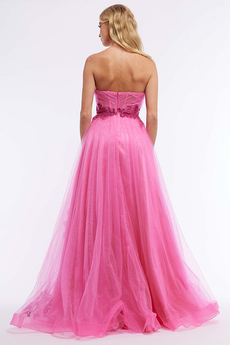 With a stunning strapless design, intricate beading, and a playful slit, the Vienna Prom 7881 Long Prom Dress is the perfect choice for any formal occasion. The corset style bodice provides a flattering fit, while the tulle fabric adds a touch of elegance. Make a statement in this beautiful pageant gown.