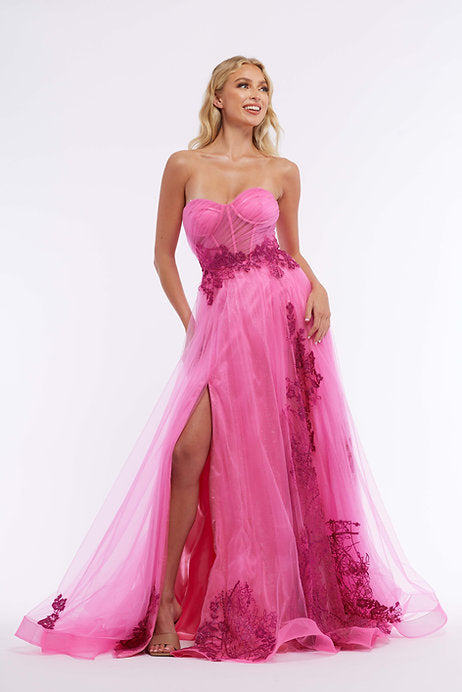 With a stunning strapless design, intricate beading, and a playful slit, the Vienna Prom 7881 Long Prom Dress is the perfect choice for any formal occasion. The corset style bodice provides a flattering fit, while the tulle fabric adds a touch of elegance. Make a statement in this beautiful pageant gown.