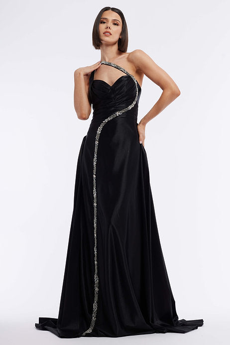 Experience elegance and sophistication in the Vienna Prom 7884 Long Prom Dress. This stunning one-shoulder gown features intricate beadwork and a high-leg slit, perfect for showcasing your figure. Ideal for formal events and pageants, this gown will make you feel confident and glamorous all night long.