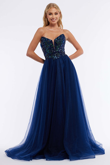 The Vienna Prom 7888 is a stunning long prom dress perfect for any formal occasion. The strapless sequin bodice adds a touch of sparkle, while the tulle skirt adds a touch of elegance. This dress is sure to make a statement and turn heads wherever you go.
