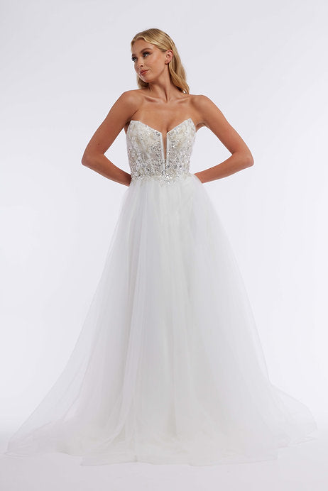 The Vienna Prom 7888 is a stunning long prom dress perfect for any formal occasion. The strapless sequin bodice adds a touch of sparkle, while the tulle skirt adds a touch of elegance. This dress is sure to make a statement and turn heads wherever you go.