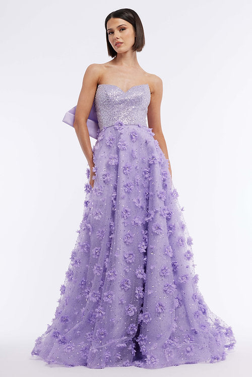Elevate your formal look with the Vienna Prom 7891 Long Prom Dress. Featuring a strapless design, large back bow, and 3D floral embellishments, this gown exudes elegance and sophistication. With a sheer train for added drama, this dress is perfect for proms, pageants, and formal events.