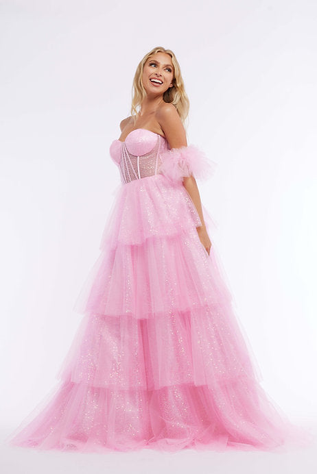 Step into the spotlight with the Vienna Prom 7894 Long Prom Dress. The corset top provides a flattering fit, while the sheer layered glitter tulle skirt adds a touch of glamour. Perfect for formal events or pageants, this gown will make you feel like a star.