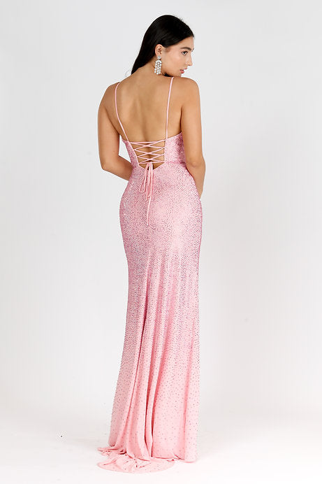 Elevate your prom or formal evening look with the Vienna Prom 7940 Long Dress. Its V-neck and sleeveless design will flatter your figure, while the high slit adds a touch of elegance. Perfect for pageants and other special occasions, this dress exudes sophistication and style.