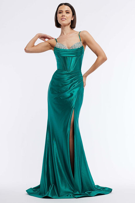 This Vienna Prom 7959 Long Prom Dress features a beautiful satin corset, embellished with intricate beadwork and stunning ruching details. The elegant slit train adds a touch of sophistication to this formal pageant gown. Make a statement at your next event with this timeless and luxurious dress.