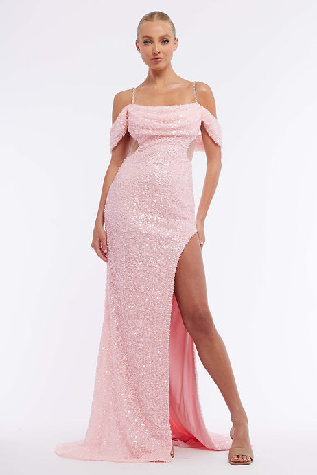 Elevate your style with the Vienna Prom 7963 Long Prom Dress. Featuring an off-shoulder cut, sequin details, and a stunning slit, this dress is perfect for any formal occasion. The open back and sheer fabric add an alluring touch, making you stand out from the crowd. Shine bright like a star in this pageant-worthy gown.