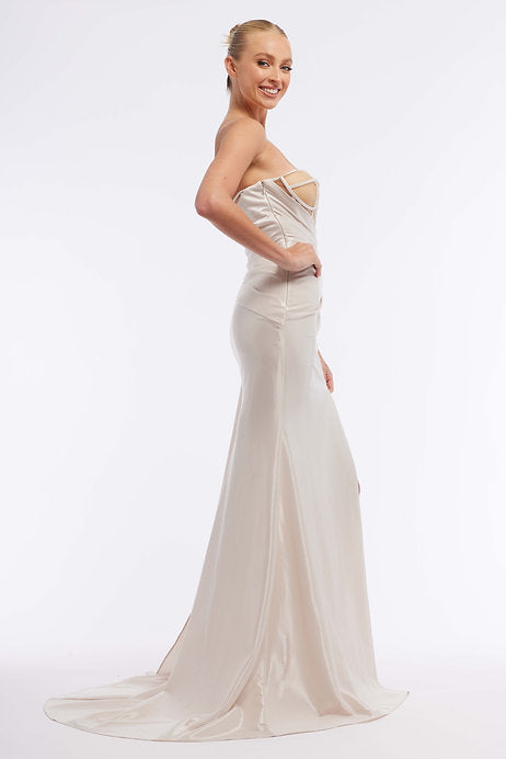 This Vienna Prom 7964 long prom dress features a one shoulder design with a sheer bodice, creating a modern and stylish look. The maxi length and slit cut out add allure and elegance, while the formal pageant gown design makes it perfect for any special occasion.