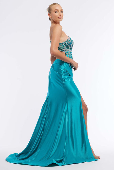 Expertly designed for a glamorous and sophisticated look, the Vienna Prom 7974 Long Prom Dress is a stunning choice. The fitted asymmetrical neckline highlights your curves, while the intricate beading adds elegant detail. With a high slit and formal pageant gown silhouette, this dress exudes confidence and style.