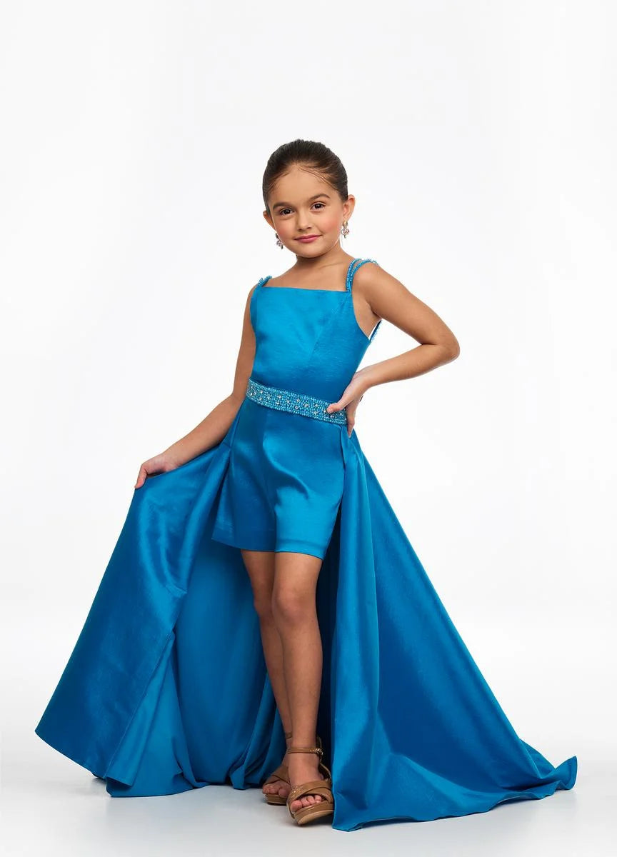 Ashley Lauren Kids 8131 Stretch Taffeta Romper Fun Fashion Overskirt Pageant Wear This stretch tafetta romper features a double spaghetti strap giving way to a beaded waistband. The look is completed with an attached overskirt. Double Spaghetti Strap Beaded Belt Romper Attached Overskirt Sizes: 10 ,12 Colors: Blue