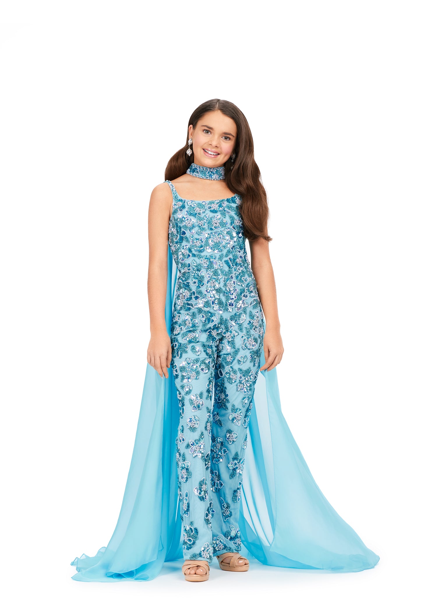 Ashley Lauren Kids 8190 Fully Beaded With Beaded Choker And Chiffon Cape Jumpsuit. A jumpsuit for a queen! This fully beaded number features a matching choker with an attached cape. This screams fabulous!