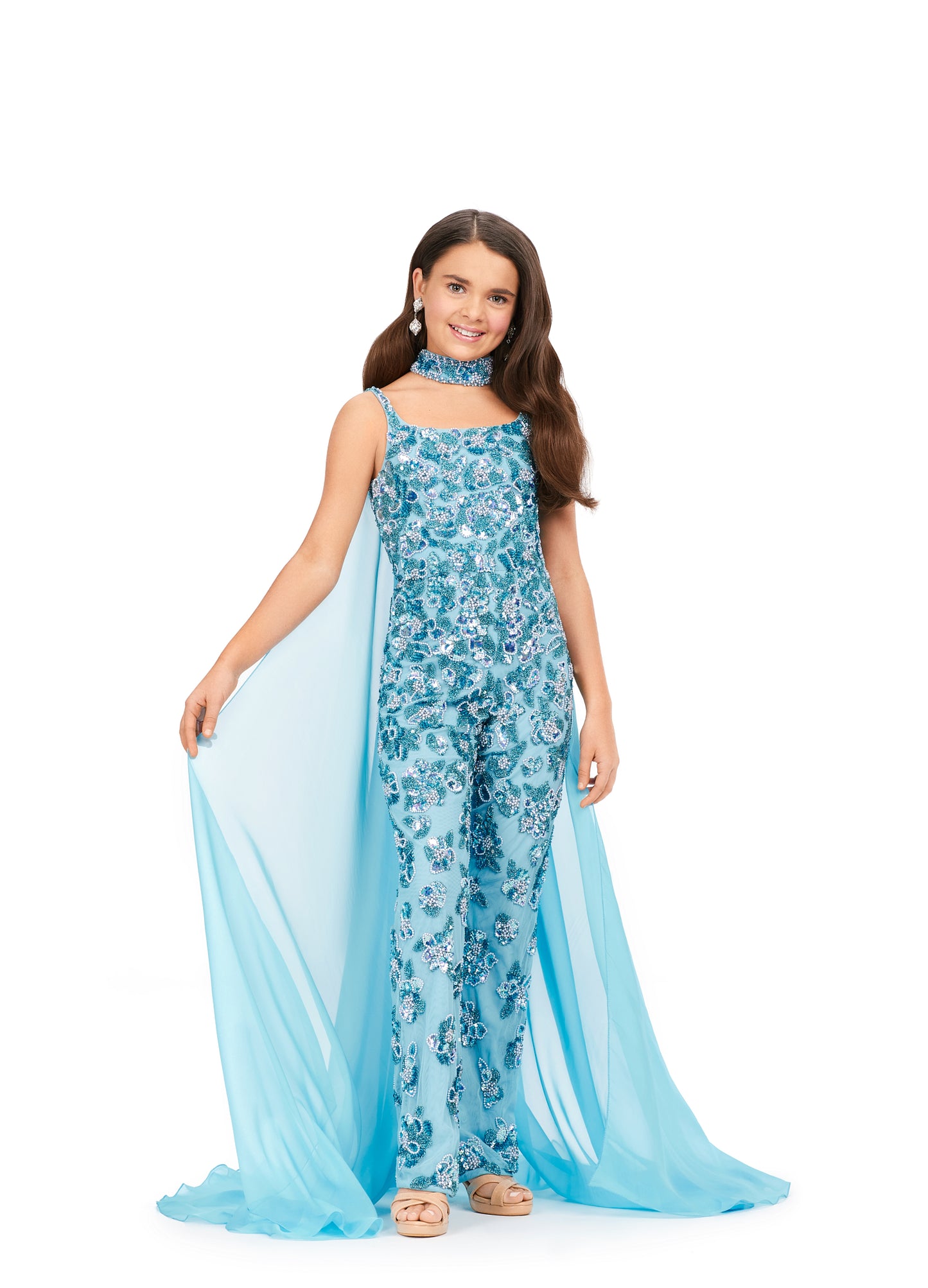 Ashley Lauren Kids 8190 Fully Beaded With Beaded Choker And Chiffon Cape Jumpsuit. A jumpsuit for a queen! This fully beaded number features a matching choker with an attached cape. This screams fabulous!