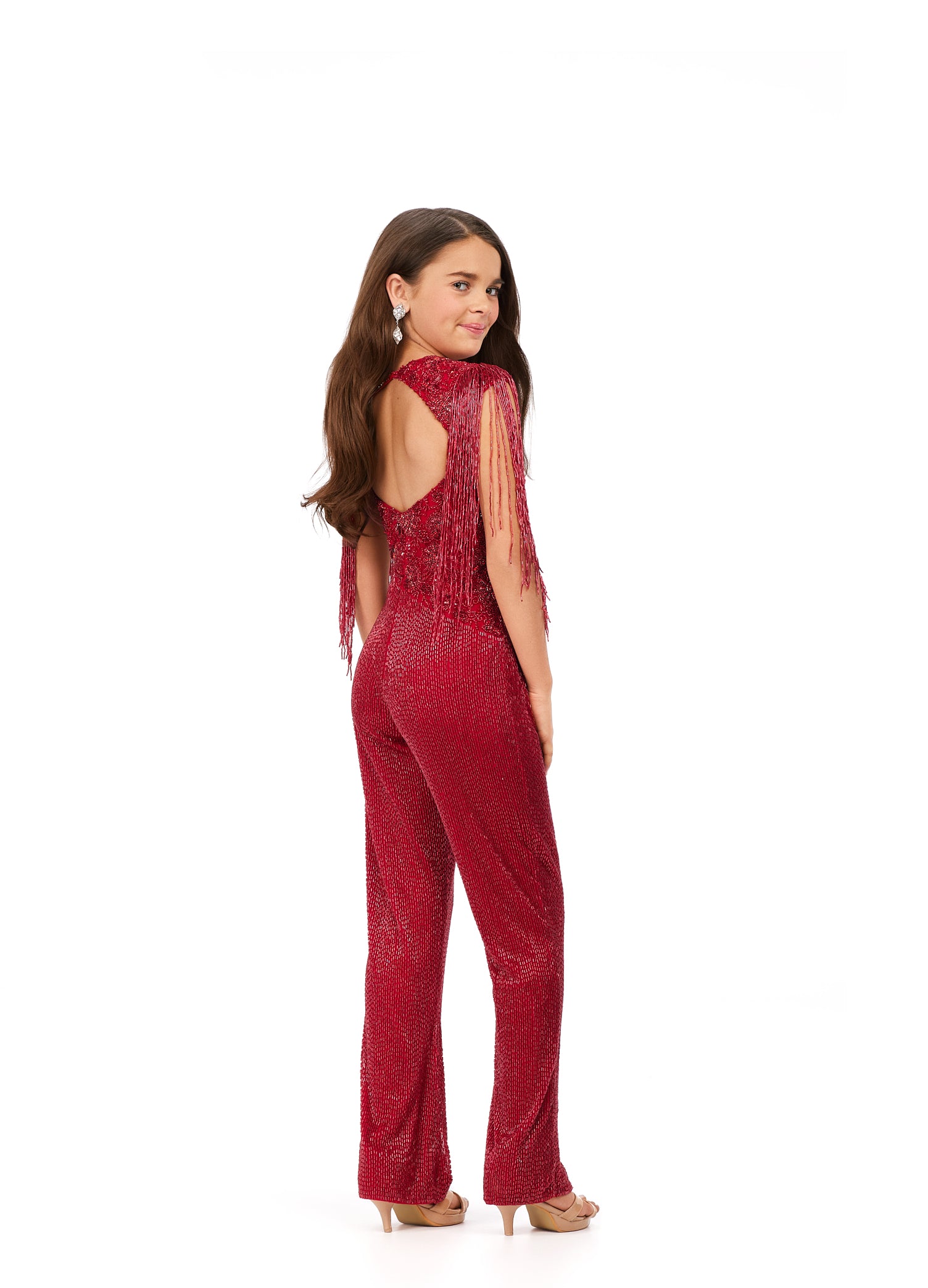 Ashley Lauren Kids 8193 Liquid Beaded Crew Neckline With Fringe Sleeves Jumpsuit. This fully beaded jumpsuit is sure to make you stand out! From the high neckline to the fringe detailed shoulders, we give this a 10/10!