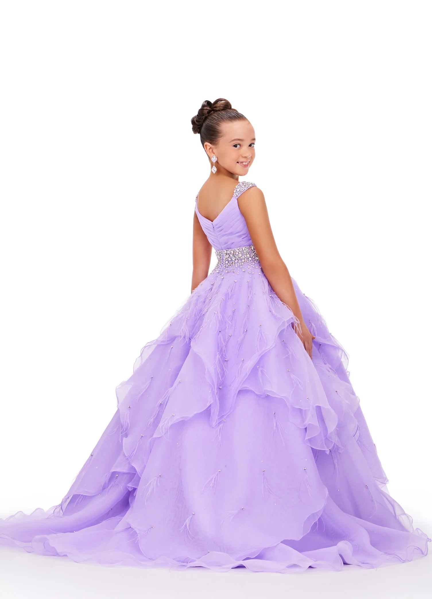 Elevate your little one's pageant look with the Ashley Lauren Kids 8219 Girls Layered Feather Pageant Dress. This stunning ballgown features a V-neck embellished with feathers, adding a touch of glamour to the overall design. With its layered skirt, this dress will make your child feel like a princess on stage. Be the star of the show in this fabulous organza ball gown