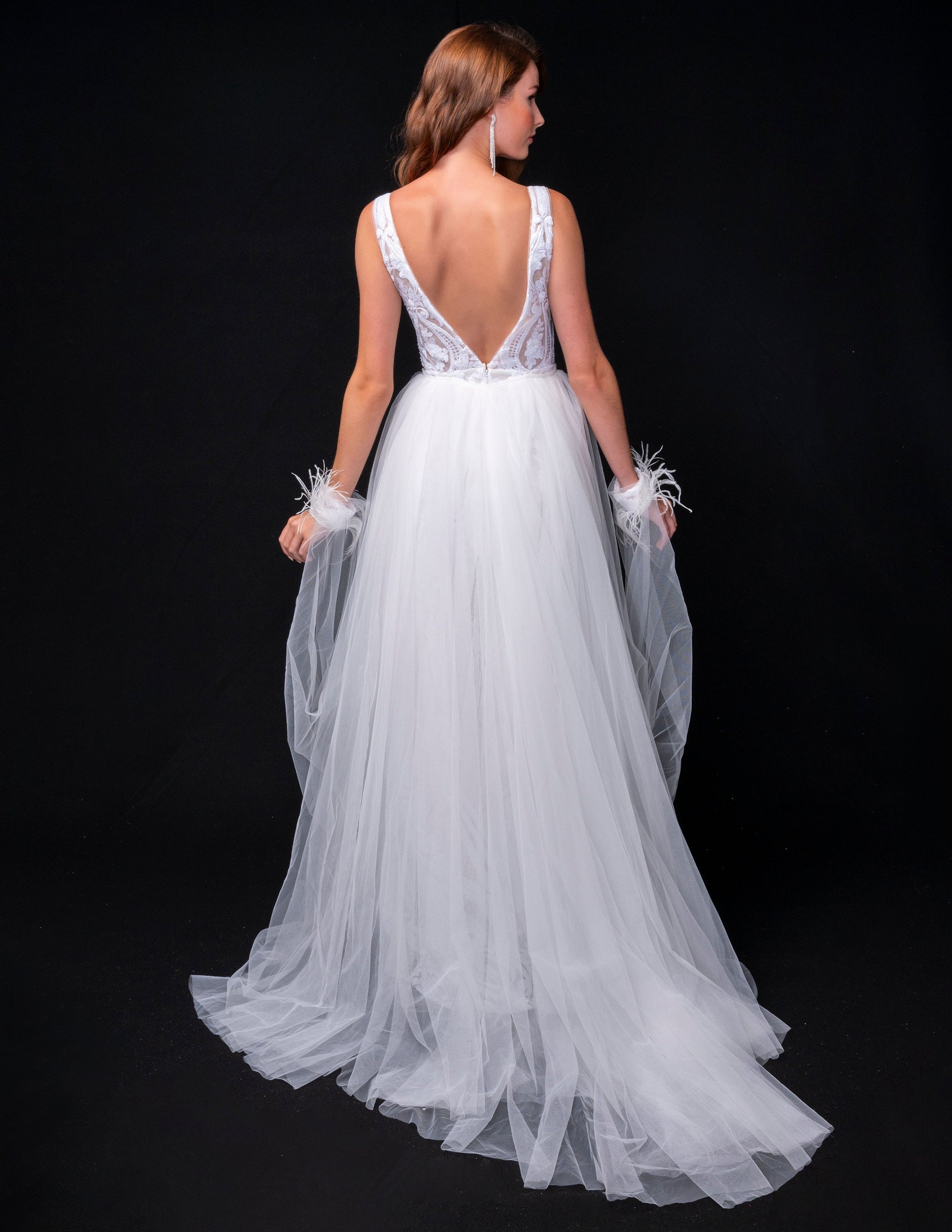 <p data-mce-fragment="1">This stunning Nina Canacci 8224 long, fitted pageant dress features a dazzling sequin design and a detachable tulle overskirt with a feather cuff. The elegant V-neckline adds a touch of sophistication to this show-stopping gown. Perfect for any formal event or pageant, this dress is sure to make a statement.</p> <p data-mce-fragment="1">&nbsp;</p>