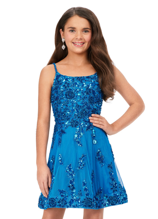 Ashley Lauren Kids 8228 Fully Beaded A-Line Open Cross Back Spaghetti Strap Lace Cocktail Dress. This fun and flowy cocktail has an intricate bead pattern that cascades down the A-line skirt. The lace up back helps ensure a perfect fit!