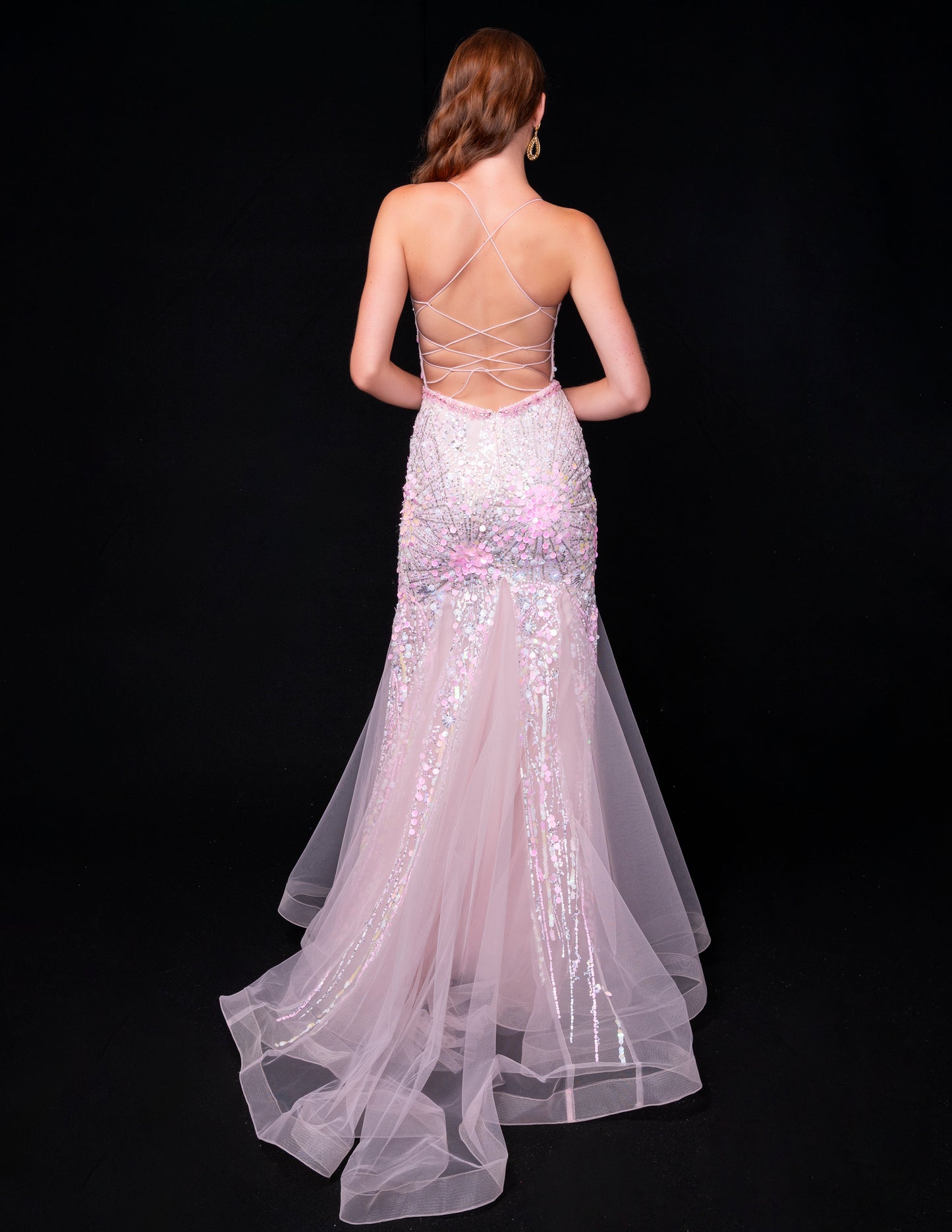 Achieve a stunning look with the Nina Canacci 8232 Sheer Corset Sequin Mermaid Prom Dress. This backless formal gown features a sheer corset, sequin details, and a mermaid silhouette for a show-stopping appearance. Perfect for prom or any formal event, this dress will make you feel confident and elegant.
