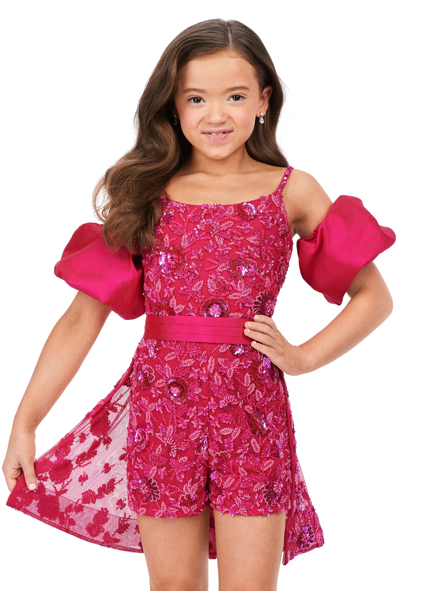 Ashley Lauren Kids 8233 Fully Beaded Spaghetti Straps With Detachable Puff Sleeves Detachable Overskirt Romper. Have the most fun in this beaded romper complete with detachable puff sleeves and an overskirt!
