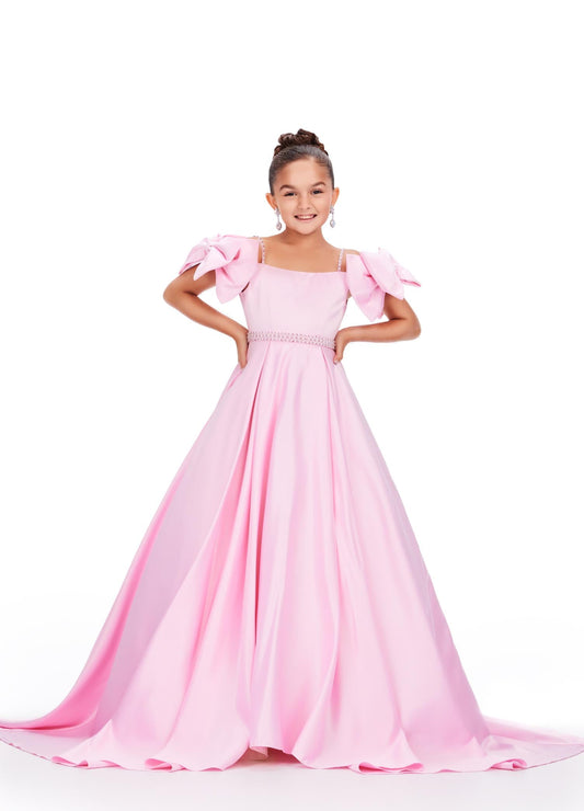 Ashley Lauren Kids 8237 Off the Shoulder Satin Ball Gown Pageant Dress Bows A Line Girls Feel like a princess in this satin ball gown. This gown features off the shoulder bows and pearl accents on the straps and belt.  COLORS: Aqua, Pink, White, Lilac Sizes: 2-16 Off Shoulder Beaded Accents Ball Gown Satin