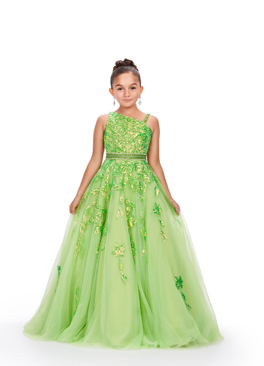 Get ready to dazzle in this stunning Ashley Lauren Kids 8240 Girls Ballgown! With its long tulle skirt and intricate sequin and lace detailing, this one-shoulder dress will make your little one feel like a pageant princess. Expertly crafted, this dress exudes elegance and sophistication. This one shoulder kids tulle ball gown features a sequin applique bodice giving way to a beaded waistline. The sequin applique trickle down onto the full a-line skirt.