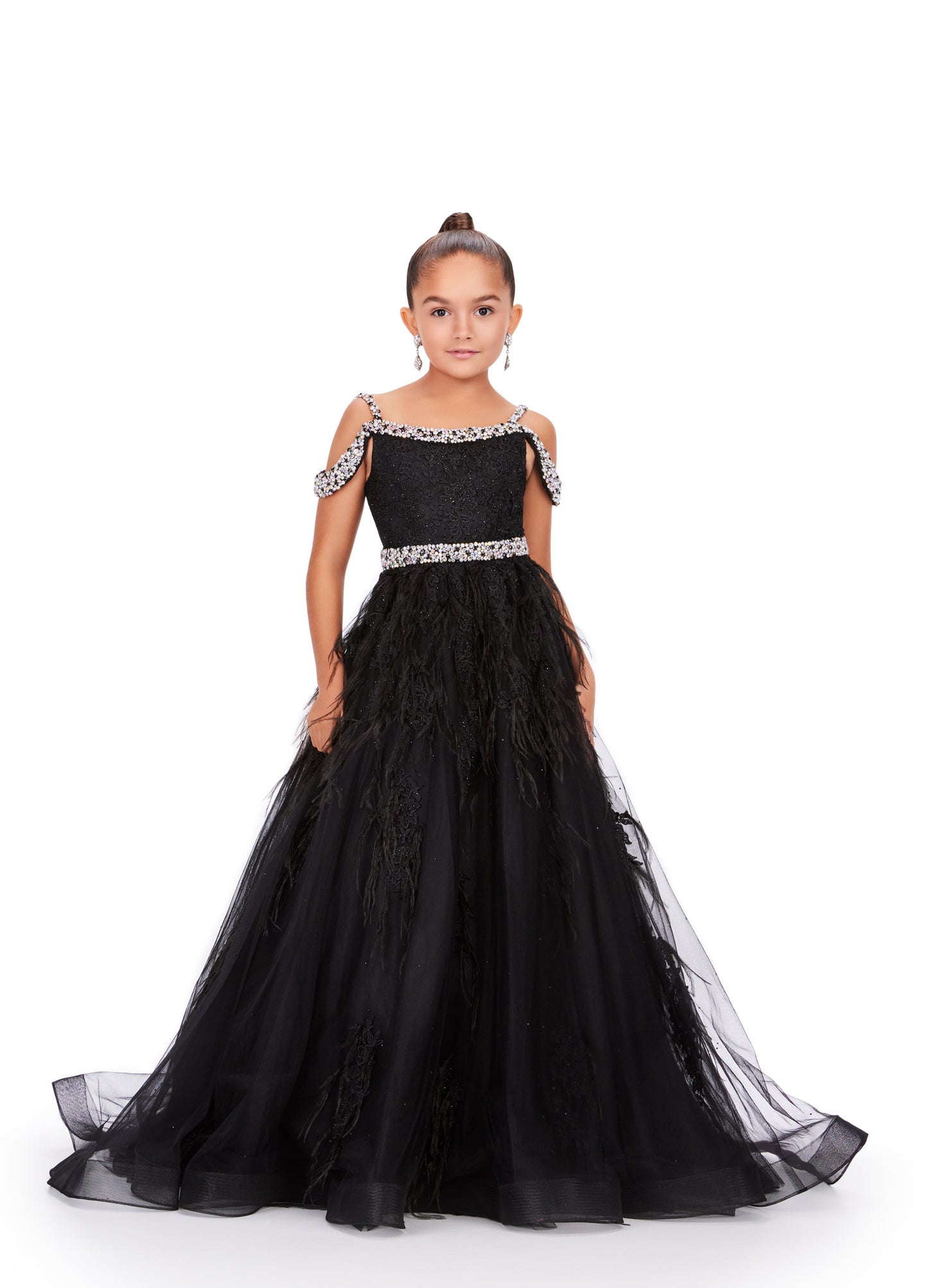 Experience the epitome of elegance and grace with the Ashley Lauren Kids 8242 Girls Lace Feather Pageant Dress. Featuring delicate lace and stunning feather accents, this off the shoulder ballgown is the perfect choice for any special occasion. Its impeccable design and craftsmanship will make your little girl feel like a true princess. This gorgeous kids gown is embellished with crystal beaded straps, neckline trim and belt. The dress is adorned with lace applique, press on stones and feather accents.